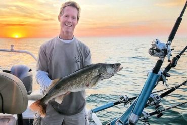 Man holding a walleye